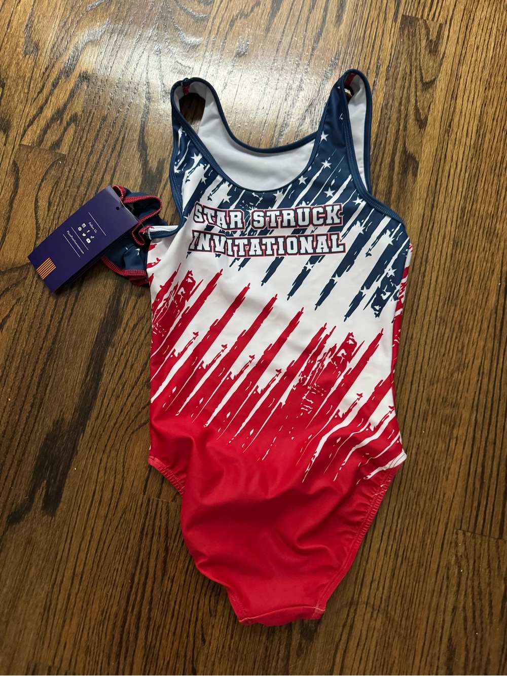 Star Struck Invitational Women’s Red, White & Blue One-Piece gymnastics leotard